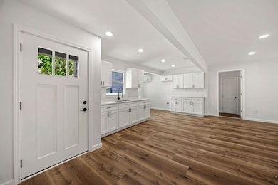 Front entryway leading to the large kitchen and li