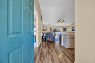 Entryway featuring dark wood-type flooring, basebo
