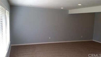 Living room view and formal dining area from entry