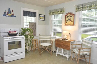 Bright and cheerful eat in kitchen.