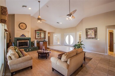 Large formal living room with marble fireplace and