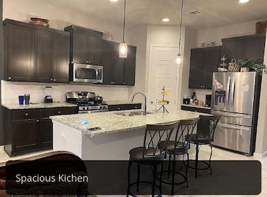 Kitchen with appliances with stainless steel fini