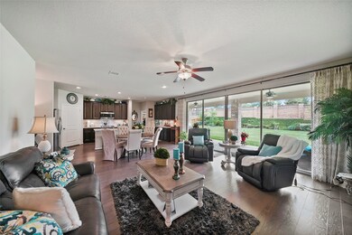 OPEN CONCEPT LIVING  The amazing glass wall brings the outdoors inside & expands the livable space. Welcome each Season with this open air scene as the backdrop to your life. Very energy efficient with all low E windows.
