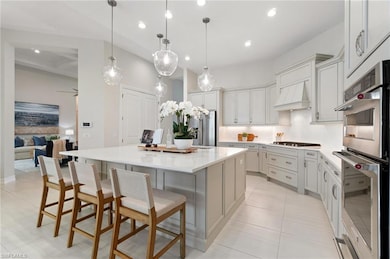Light and bright kitchen with gas stove and stainless steel appliances