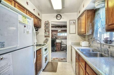 
Galley kitchen that opens up on one end into the 