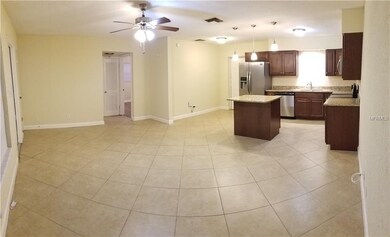 LIVING TOOM WITH VIEW OF KITCHEN (RIGHT)