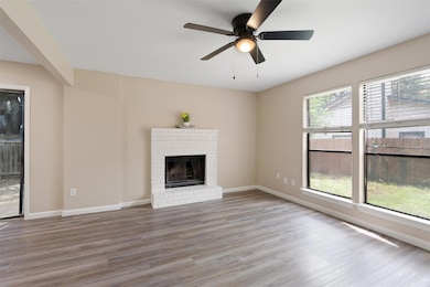 Unfurnished living room with wood finished floors