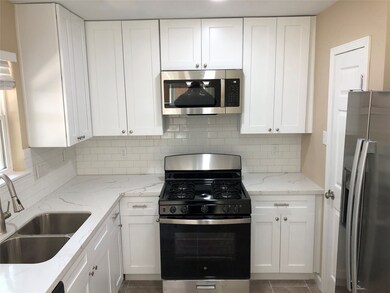 Kitchen with Quartz Countertops and Stainless Appliances