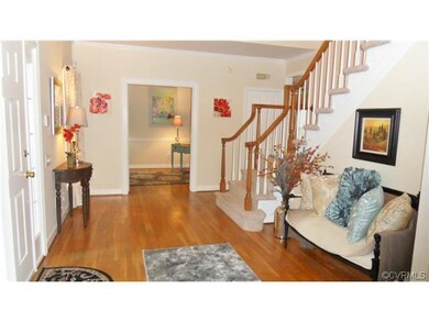 Elegant two-story foyer with hardwood flooring in 
