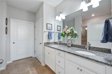 Primary Bath with dual vanity and walk in shower. Large walk in closet and linen closet too!