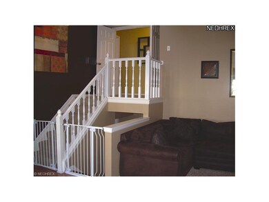 Steps lead up to master suite