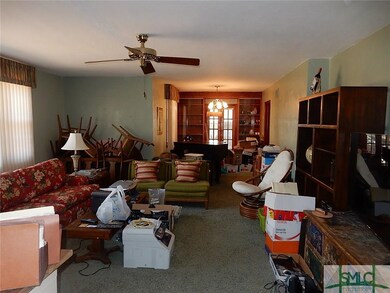 Large living room with lots of natural light.  Con