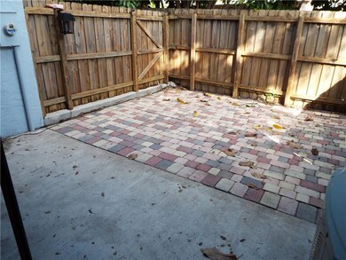 Fenced paver patio