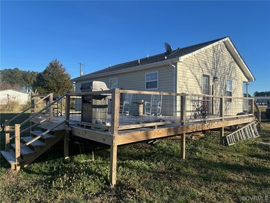 Back of property with a deck
