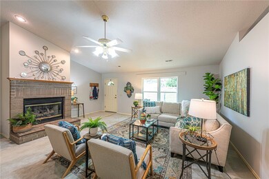 Living room features gas log fireplace