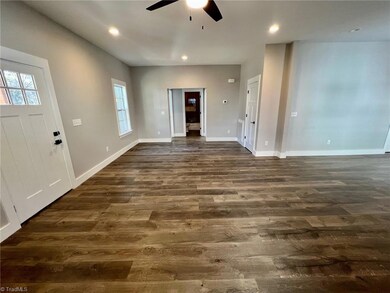 Spacious Living Room.  All New Laminate flooring throughout home.