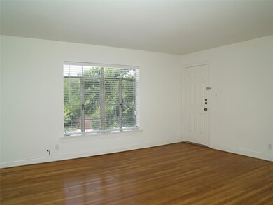 Empty room with baseboards and wood finished floo
