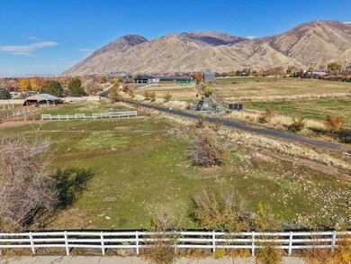 View of mountain backdrop with rural landscape