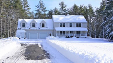 Paved driveway with attached 3 car...