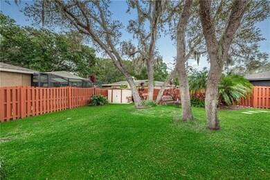 Lush yard, fenced property and shed