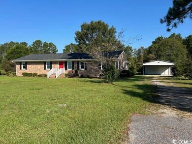 Ranch-style house with a front lawn