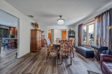 Dining area with dark wood finished floors, visibl