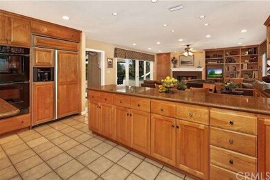 Another view of the kitchen with double oven, buil