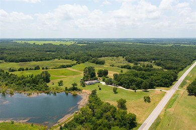 Overview of rural landscape featuring a nearby body of water
