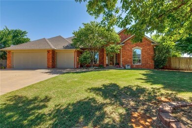 Ranch-style house with a front lawn and a garage