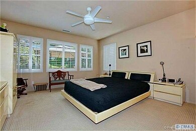 The spacious Master Suite boasts custom shutters, 
