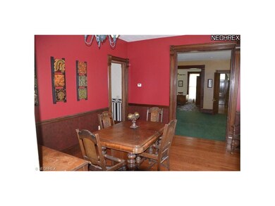 Dining room with sumptuous woodwork and hard wood 