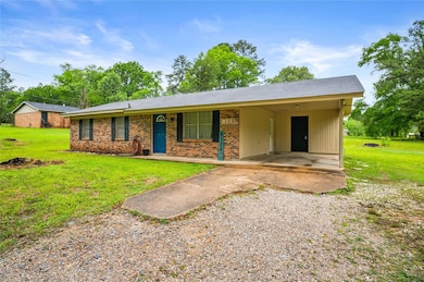 Single story home featuring driveway, an attached 