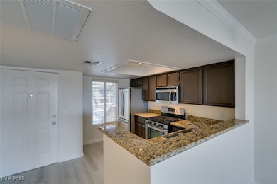 Kitchen featuring appliances with stainless steel