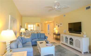 Living room featuring light tile patterned floors,