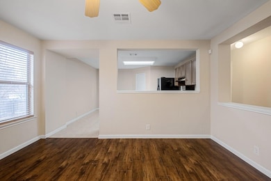 Unfurnished room with wood finished floors and ce