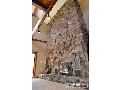 Soaring 20 Ft Stone Fireplace with Rock from Property