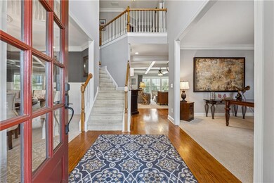 Entrance foyer featuring a towering ceiling, ceili