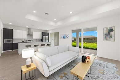 Unfurnished living room featuring sink, light hard