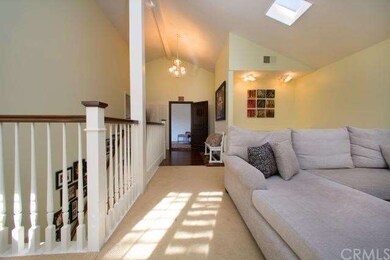 Living room accented by beautiful hardwood baniste