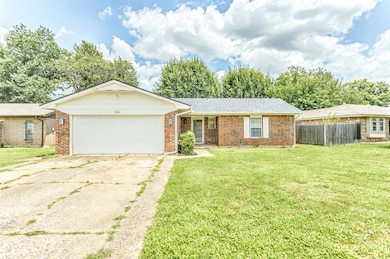 Ranch-style house with brick siding, an attached garage, concrete driveway, and roof with shingles