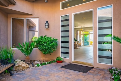 Doorway to property featuring stucco siding