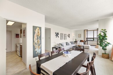 Full view of dining/living room, behind the sofa i