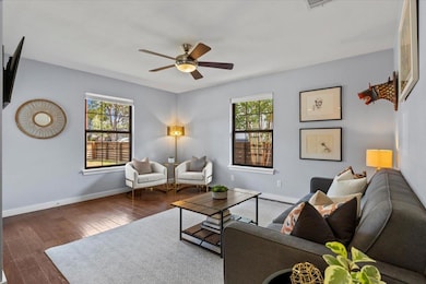 Perfect black-framed windows flood the space with natural light while adding a touch of sophistication and style.