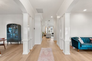 You are greeted by elegant white columns framing t