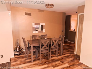 Dining area featuring baseboards and wood finished floors