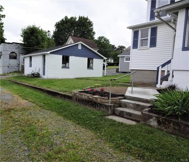 The back yard an a 2 car garage