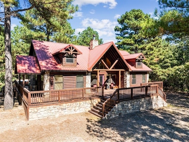 Cabin featuring a deck