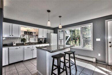 Lovely kitchen with granite bar,...