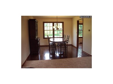 Gorgeous wood floors in this open dining room.