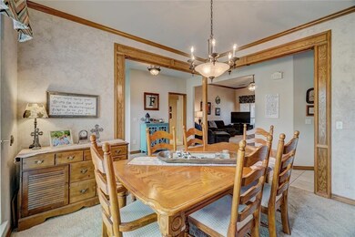 Formal dining room looking toward the foyer and living area.